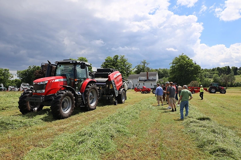 Crowd watching Massey Ferguson hay equipment in action during Eklund Hay Days demonstration
