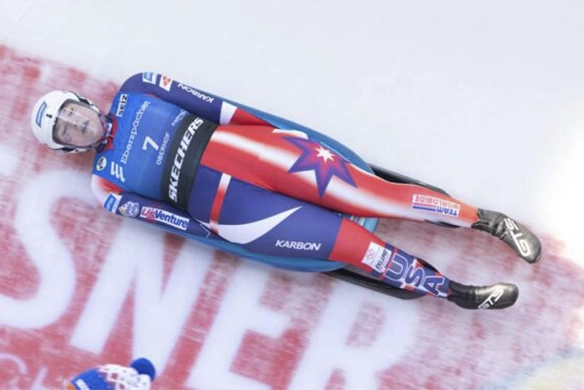 Team USA luge athlete competing in full-speed race at the Olympic Games